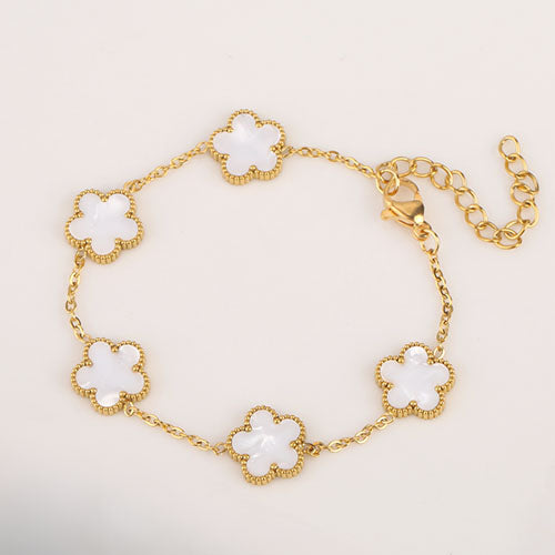 another image of white and gold flower charm dainty bracelet
