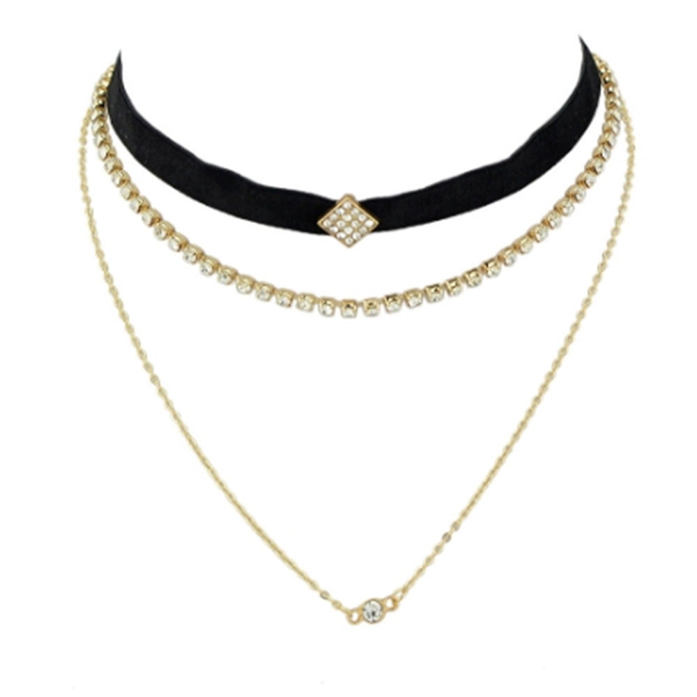 The stylish layered choker from Kelabu, with velvet, gold and crystal designs, on a plain white background