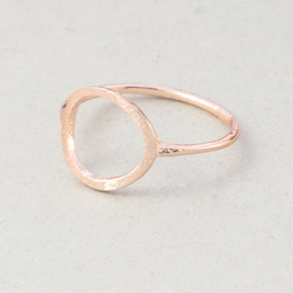 The Kelabu Karma Circle bohemian rings in rose gold on a light coloured background