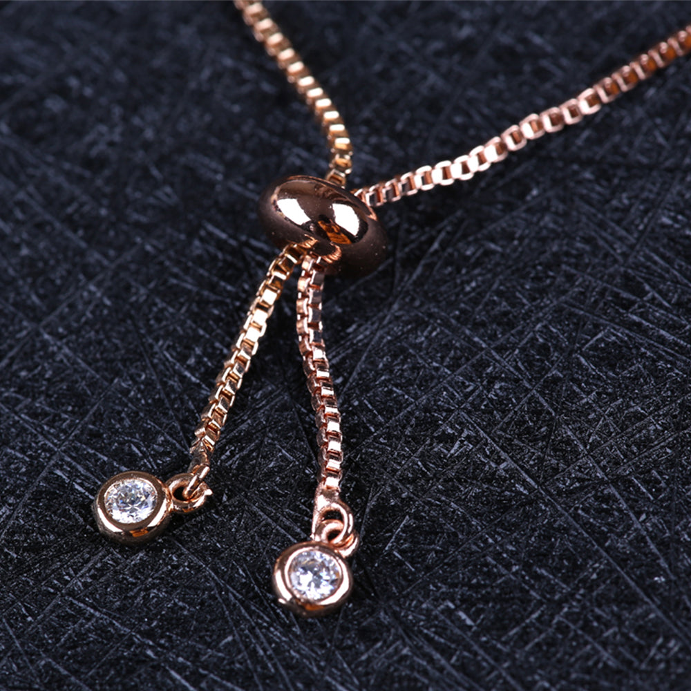 Close up of the delicate tie bracelet fastening and sparkling additions to the tie design