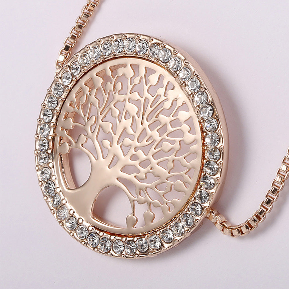 Close up of the gold tree bracelet design where the intricate design of the tree of life pattern is shown, as well as the beautiful diamond additions