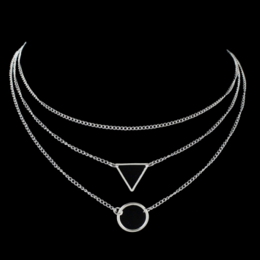 The Kelabu geometric statement necklace in Silver on a plain black background