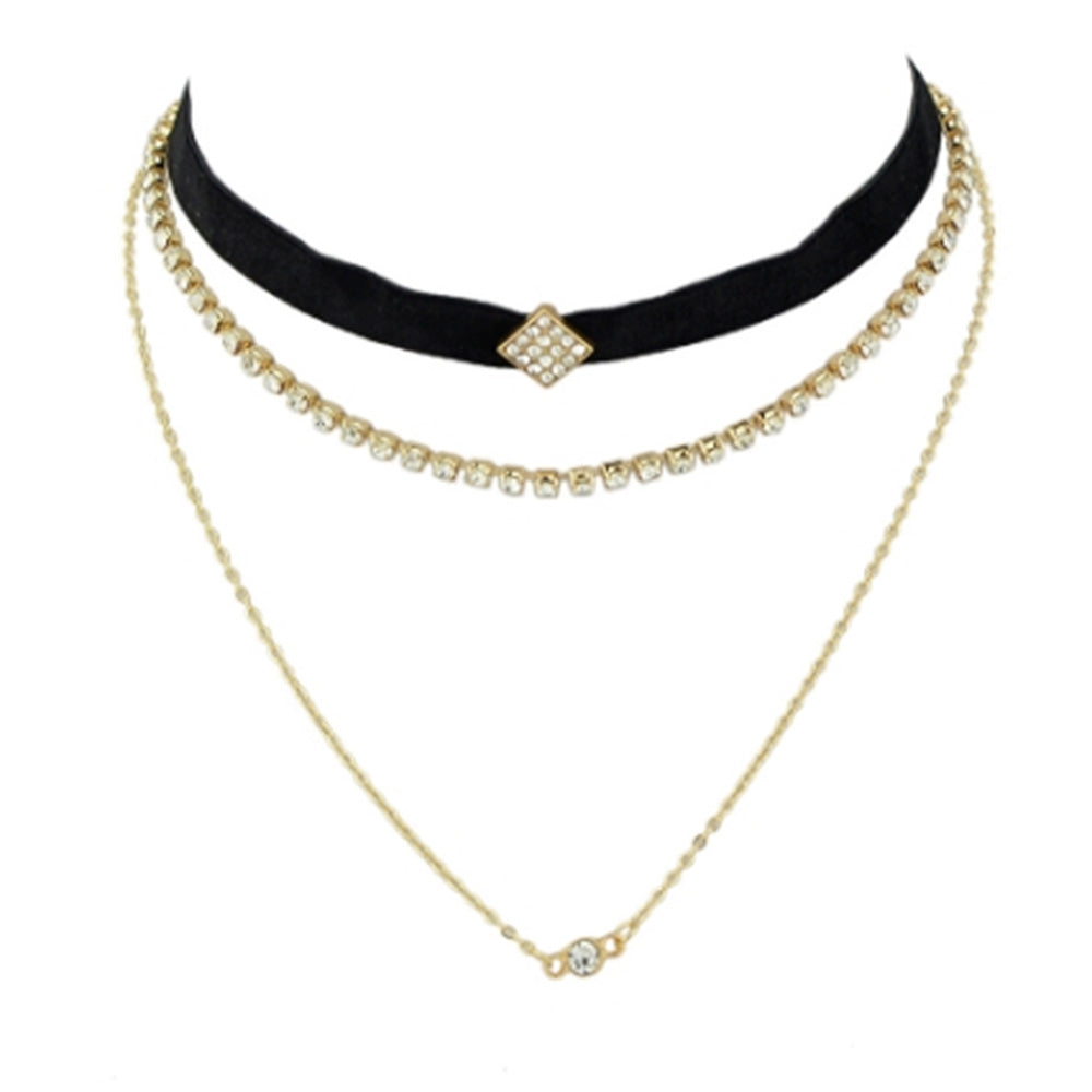 The stylish layered choker from Kelabu, with velvet, gold and crystal designs, on a plain white background 