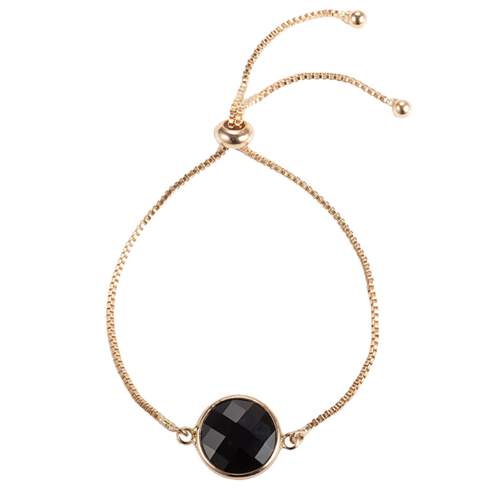 The beautiful Kelabu beaded tie bracelet with gold chain and black pendant on a plain white background 
