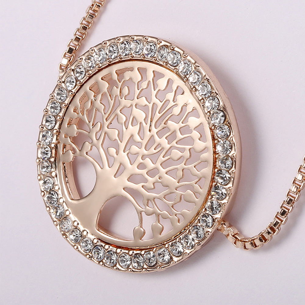 Close up of the gold tree bracelet design where the intricate design of the tree of life pattern is shown, as well as the beautiful diamond additions 